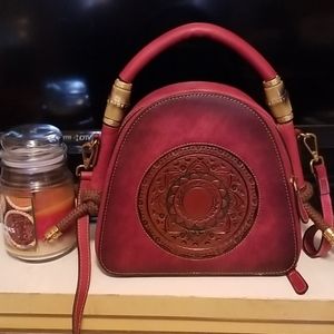 Dark red purse.